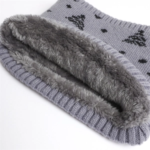 Detail view of winter knitted neck warmer with thick faux fleece lining and star pattern