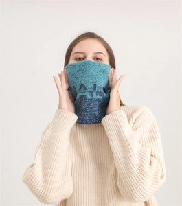 Detailed knit of gradient thick neck gaiter with decorative letters and soft warm texture