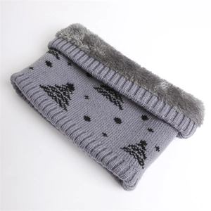 Close-up of gray knit winter neck warmer with plush lining and black tree patterns