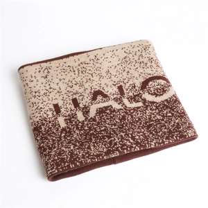 Detail of gradient knit neck warmer with HALO lettering and soft textured finish
