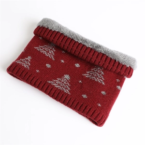 Detail of winter knitted neck warmer with dark red pattern and thick grey faux fur lining