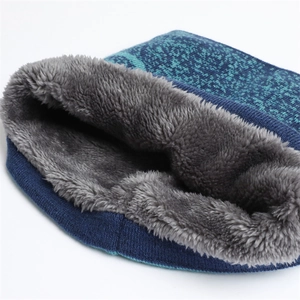 Detail of blue gradient knit snood scarf featuring thick grey faux fur lining