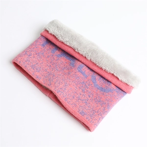 Detail of pink and purple gradient knit scarf with thick white fleece lining for winter
