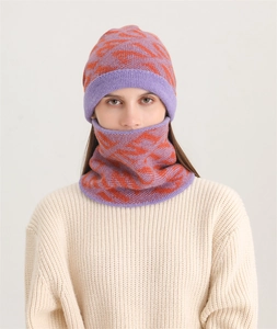 Close-up of women winter knit hat and scarf set with purple and orange stripe pattern