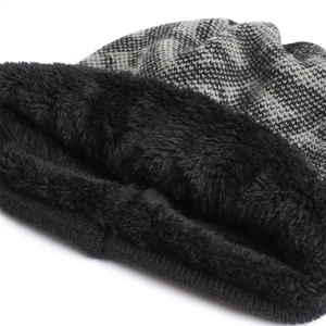 Detailed macro view of the double-layered thick knit hat with soft black fleece lining