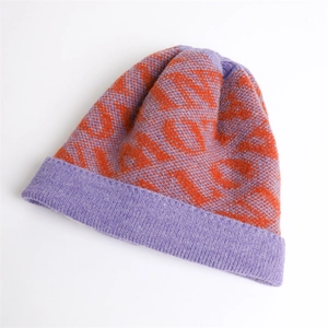 Detail of purple and orange color-block knit beanie with geometric jacquard pattern