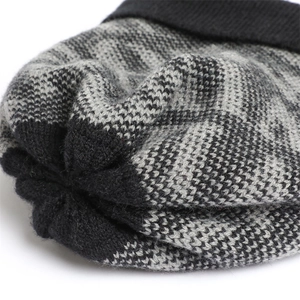 Macro shot of tricolor knit pattern and detailed stitching on warm winter hat