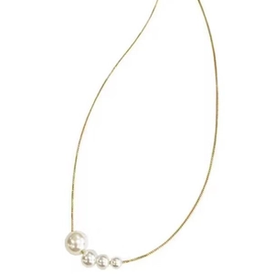 French minimalist gold necklace with four gradient pearls in linear elegant design
