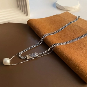 Double-layer stainless steel necklace featuring a rectangle pendant and a pearl drop charm