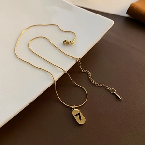 Minimalist gold titanium steel necklace with lucky number 7 pendant and snake bone chain