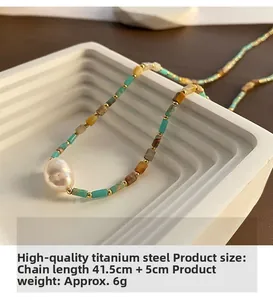 Close-up of baroque pearl and turquoise beaded necklace made of titanium steel