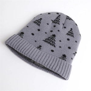 Grey knit winter beanie with black pine tree patterns and ribbed cuff for warmth