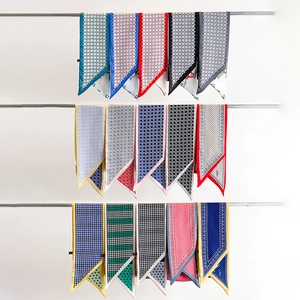 Selection of printed narrow silk scarves in classic patterns like houndstooth and polka dots