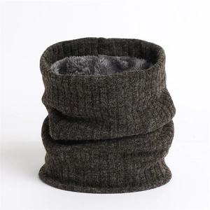 Detail of coffee knit neck warmer with thick grey fleece lining and ribbed texture