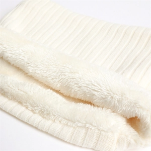 Detail of cream rib-knit neck warmer featuring thick white plush fleece lining for winter