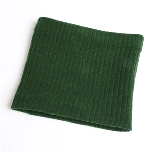 Macro detail of dark green rib-knit snood with thick thermal texture and elastic weave