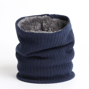 Close-up of deep blue ribbed knit texture and thick grey fleece lining for winter neck gaiter