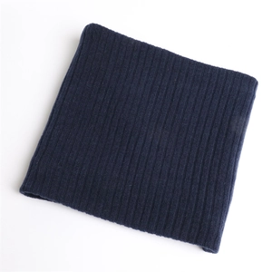 Flat lay macro view of the navy blue ribbed knit texture and elastic thick fabric