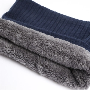 Close-up of winter neck warmer with navy knit texture and thick grey fleece lining