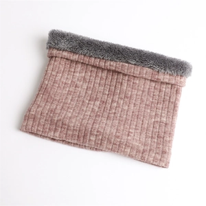 Close-up of ribbed knit winter neck gaiter with soft grey fleece lining detail