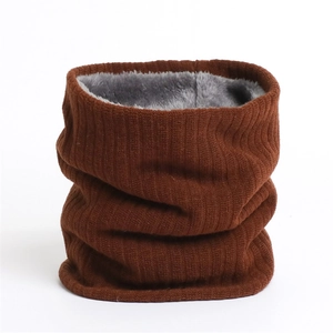 Detail of brown ribbed knit winter neck warmer featuring soft grey fleece lining texture