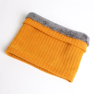 Close-up of winter knit neck warmer with orange ribbed exterior and thick grey fleece lining
