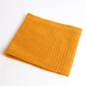 Close-up of bright yellow ribbed knit neck warmer showing elastic texture and soft lining