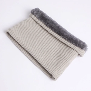 Detail of chunky knit neck warmer with thick faux fur lining for winter protection