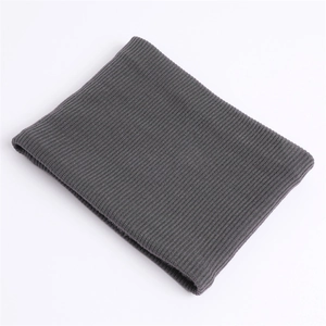 Close-up of thick rib-knit texture on dark grey winter neck warmer loop scarf