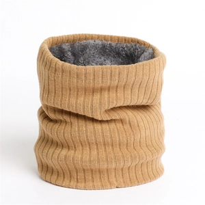 Detail of camel rib-knitted neck warmer with thick grey faux fur lining for winter warmth