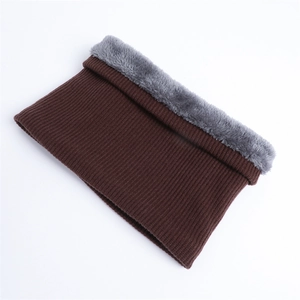 Detail of dark coffee knitted neck warmer with thick grey faux fur lining for winter