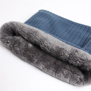 Detail of navy knit neck warmer with plush grey faux fur lining for winter warmth