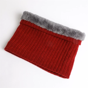 Detail of red knit neck warmer featuring thick fleece lining and ribbed texture