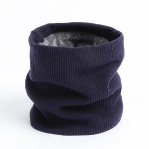 Detail of navy knit neck warmer featuring a thick grey fleece lining for winter warmth