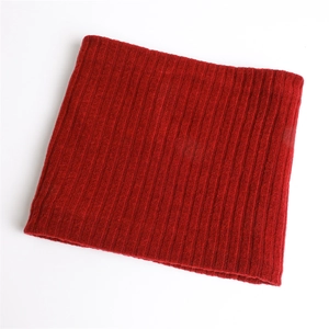 Close-up of dark red ribbed knit texture and premium warm winter neck warmer fabric