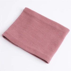 Close-up of the dusty pink ribbed knit texture on this warm winter neck warmer