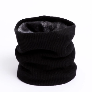 Close-up of black ribbed knit neck warmer featuring thick grey faux fleece lining