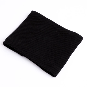 Close-up of black ribbed knit infinity scarf with thick thermal texture for winter