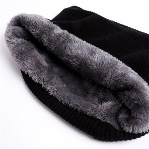 Close-up of thick knitted winter neck warmer with gray plush fleece lining for warmth
