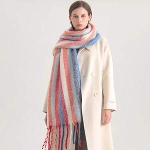 Detail view of colorful striped faux cashmere scarf featuring soft texture and fringe