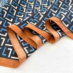 Luxury 90cm silk square scarf featuring blue and white geometric L pattern and orange borders