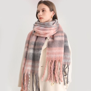 Detail of pink and grey gradient cashmere scarf with long tassels and thick texture