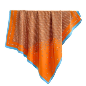 Orange and sky blue square silk scarf with geometric pattern and soft drape texture