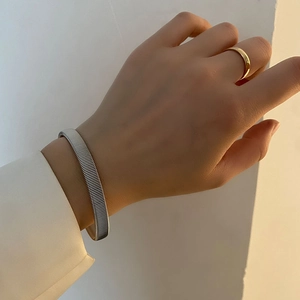 Minimalist silver textured titanium steel cuff bracelet with subtle ribbed finish