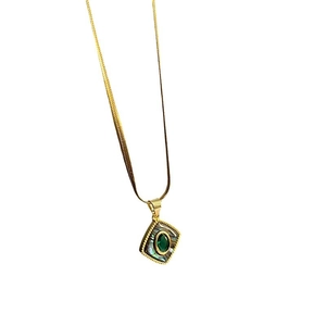 Vintage gold titanium necklace with green gemstone and abalone shell square pendant