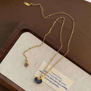 Lock pendant necklace with abalone shell in 18k gold finish on stainless steel chain