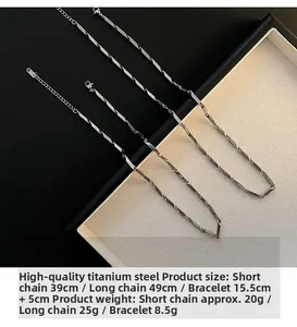 Detail of titanium steel jewelry set featuring geometric twisted necklaces and bracelet