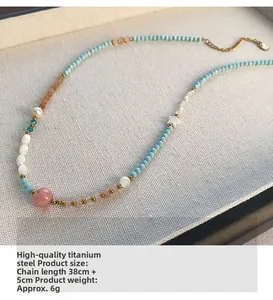 Detail of beaded star necklace with strawberry quartz and titanium steel extension