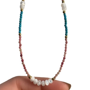 Bohemian style beaded necklace with sky blue and purple stones and white shell charms