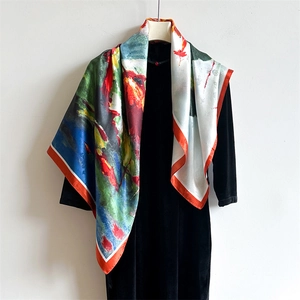 Artistic oil painting style silk square scarf with colorful floral patterns on black dress